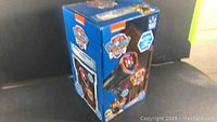 Box of Paw Patrol outdoor/indoor light show projector with colorful projected images and branding