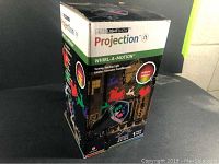 Box front showing LED Lightshow Projection product and Whirl-A-Motion feature