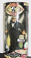 Front view of George Burns limited edition action figure in cylindrical box with visible labeling and number 1 of 1000 sticker.