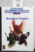 Front cover of Advanced Dungeons & Dragons 2nd Edition Monstrous Manual hardcover book showing colorful monster illustrations.