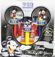 Front view of sealed Disney Mickey Mouse 80 Years PEZ set box showing three Mickey Mouse PEZ dispensers inside a Mickey Mouse-shaped window with collectible vintage poster and candy inside the dispensers.