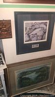 Wall art grouping showing signed print by Datisman, copper relief on left, and framed watercolor print below