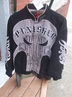 Front view of vintage Marvel Punisher jacket featuring large skull logo and text.
