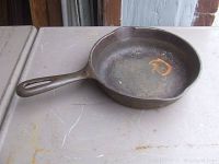 Top and inside view of the Griswold cast iron skillet showing the cooking surface with light surface rust.