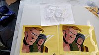 Photo showing one pencil sketch and two animation cels featuring characters from GI Joe