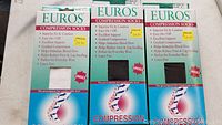 Three Euros Compression Socks packages side by side showing front of packaging with text and sock sample window.
