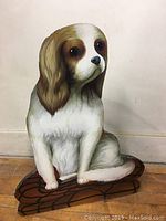 Full view of handpainted spaniel umbrella holder showing entire dog figure sitting on tiled base