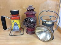 Image showing all three lanterns together, displaying their size, design, and condition.