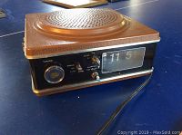 Wynford Hall clock radio front with time display and tuning knob showing the flip clock at 11:51 and sleep/alarm settings