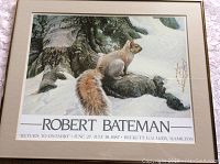 Framed matted poster print with title and exhibition details at the bottom.