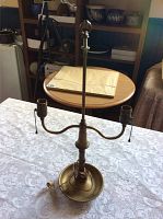 Full view of vintage brass table lamp base showing vertical column, dual arms with sockets and pull chains.