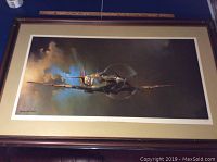 Full view of the framed print showing the entire image, frame, and glass protection.