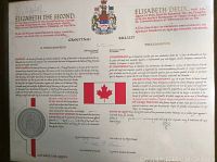 Photo of the complete proclamation document showing printed text, Canadian flag image, and printed seal at bottom left.