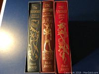 Spines of the three books showing titles, authors, and Folio Society branding with gold foil embellishments