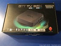 OTT TV Box in its original sealed box showing branding and technical details.