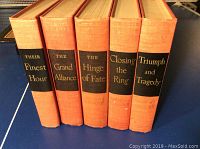 Five hardcover books with orange covers and black spine labels with gold text titled 'Their Finest Hour', 'The Grand Alliance', 'The Hinge of Fate', 'Closing the Ring', and 'Triumph and Tragedy'.