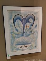 Overall view of framed watercolor painting, showing stylized blue swan shapes and two small birds, white mat and black frame