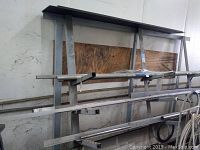 Front view of large galvanized steel rack with multiple horizontal support beams coated for rust protection.