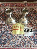 Pair of silver Empire candlesticks placed on decorative rug, accompanied by a paper note and auction lot number card. The note initially states size as 36 but seller specifies 46.