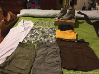 Full lot overview showing clothes laid on bed and heeled shoes on box