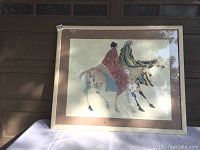 Full view of the framed Carol Grigg print depicting women on horses, showing frame, matting, and print condition.