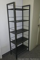Full view of the gunmetal gray metal 5-tier shelf unit showing its height and design