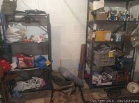 Wide shot of shelving units with various boxed and loose items including vacuum, bags, tools, and accessories.