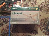 Box of Landmark 42 inch ceiling fan showing branding, product name, and overall box condition.