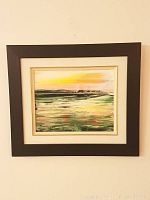 Full front view of framed painting hung on wall