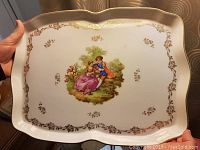 Photo of the large rectangular porcelain tray with scalloped edges showing overall design and condition.