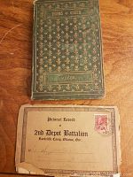 Front covers of two vintage books: one titled 'Poems of Cheer' by Wilcox with floral gold decoration, and the other a 'Pictorial Record of 2nd Depot Battalion, Rockcliffe Camp, Ottawa, Ont.' booklet with a red stamp and handwritten inscription.