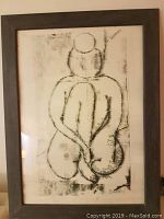 Full view of framed lithograph reproduction nude print with gray frame and visible artwork.