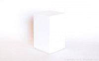 Single tall white painted rectangular riser photographed at an angle against a white background.