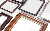 Photo showing six vintage wooden picture frames arranged on a plain background, highlighting their varying colors and styles.