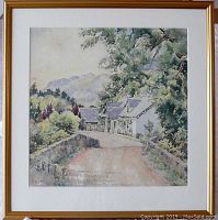 Framed watercolor painting by JG Scott MacGregor titled Ardconay Hotel showing a peaceful rural road scene with cottages, trees, and distant mountains.