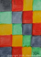 Photo of an abstract grid painting in red, yellow, green, and gray squares signed by Carin Palcer.
