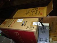 Retail box of Sony Bravia TV alongside JVC component system box and visible cassette corder