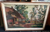 Front view of the large framed painting depicting a cottage scene with trees and a figure in the background.
