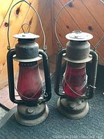 Both large vintage Beacon oil lamps side by side showing overall condition and details.