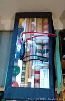 Croquet set in original packaging shows wooden mallets and balls through transparent cover
