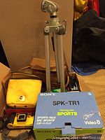 Sony Handycam Sports SPK-TR1 video camera and accessories including tripod and camera cases