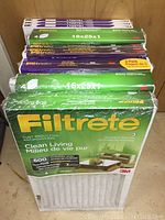 Stack of multiple boxed Filtrete furnace filters 16x25x1 in original packaging