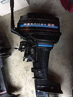 Side view showing full Mercury 9.8 outboard motor