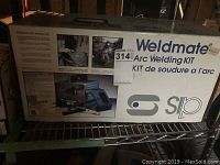 Front of sealed Weldmate Arc Welding Kit box showing product images and branding