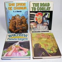 Four hardcover science fiction and fantasy books displayed together, showing their front covers and dust jackets.