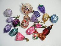Top view of all ornaments grouped showing variety and colors including bear, grape, mushroom, and multiple flowers.