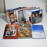 Photo of 12 DVDs including two box sets for The Waltons Season 1 and Season 2, along with 10 single DVD cases lined up behind them.