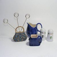 All items shown: blue ceramic cream pitcher, blue ceramic elephant toothpick holder, porcelain Ireland salt and pepper shakers, metal purse shaped card holder with rings