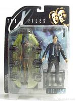 Boxed X-Files Agent Fox Mulder action figure with Cryopod Chamber accessory sealed in original blister packaging showing front and back sides.