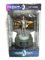 Front view of Star Trek Champions fine pewter figure of Captain Kirk in original box, showing the figure standing on a base with nameplate.